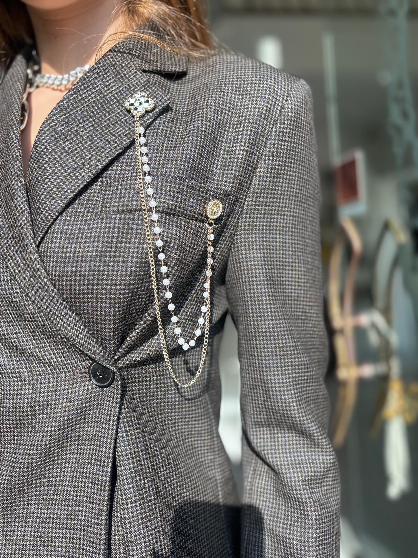 Grey blazer with jewel chain