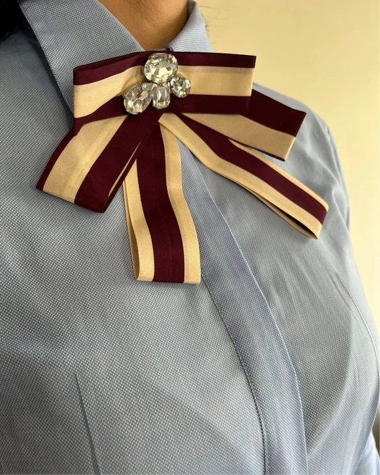 Blue shirt with jeweled bow