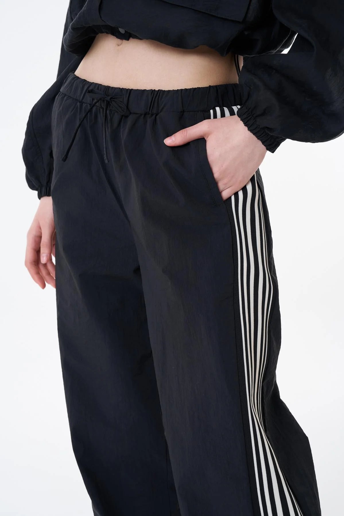 Waterproof pants with stripes on the side