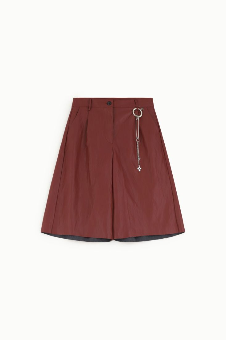Knee-length faux leather shorts