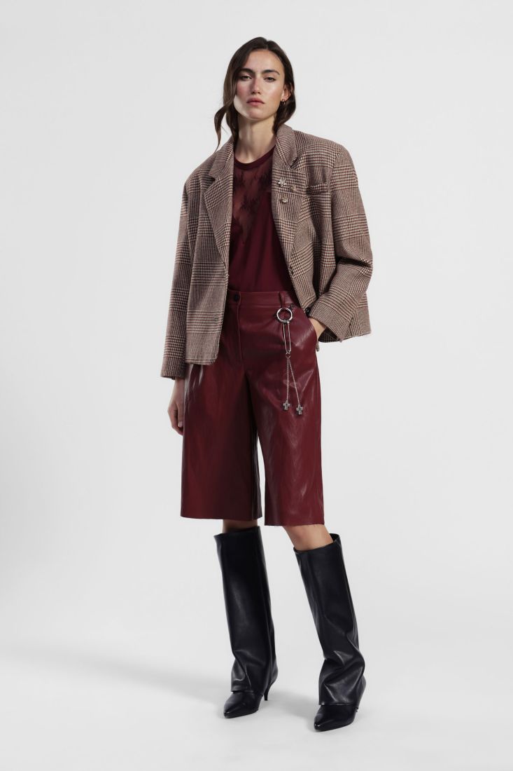 Knee-length faux leather shorts