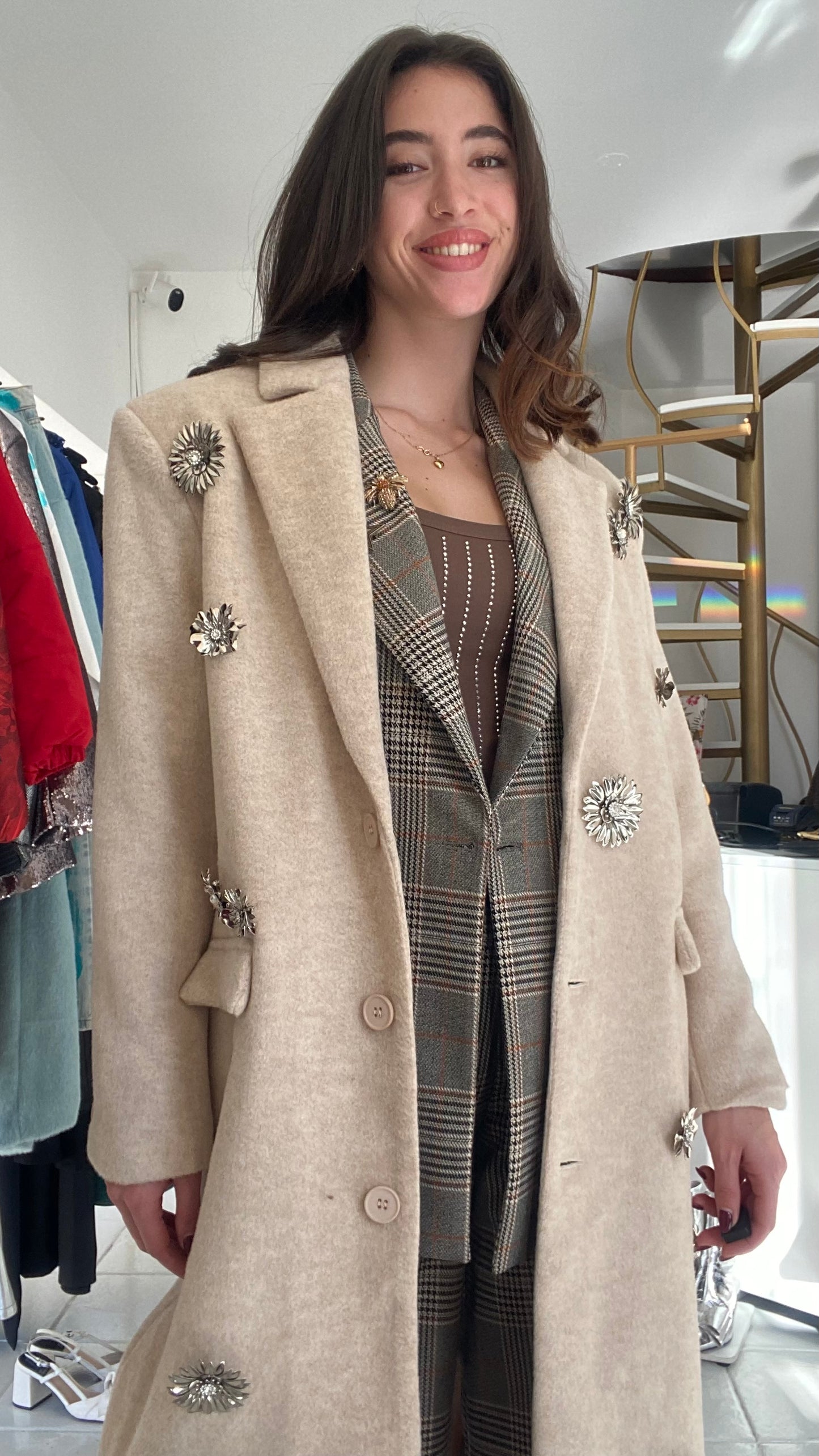 Coat with brooches