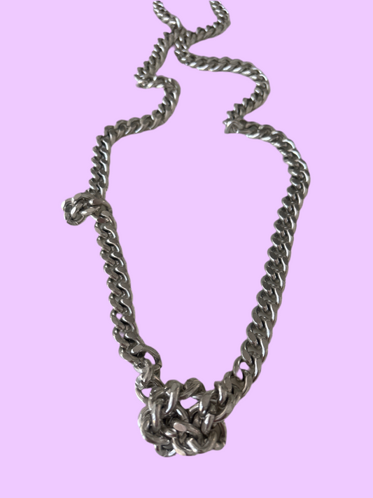 Long silver chain with a knot