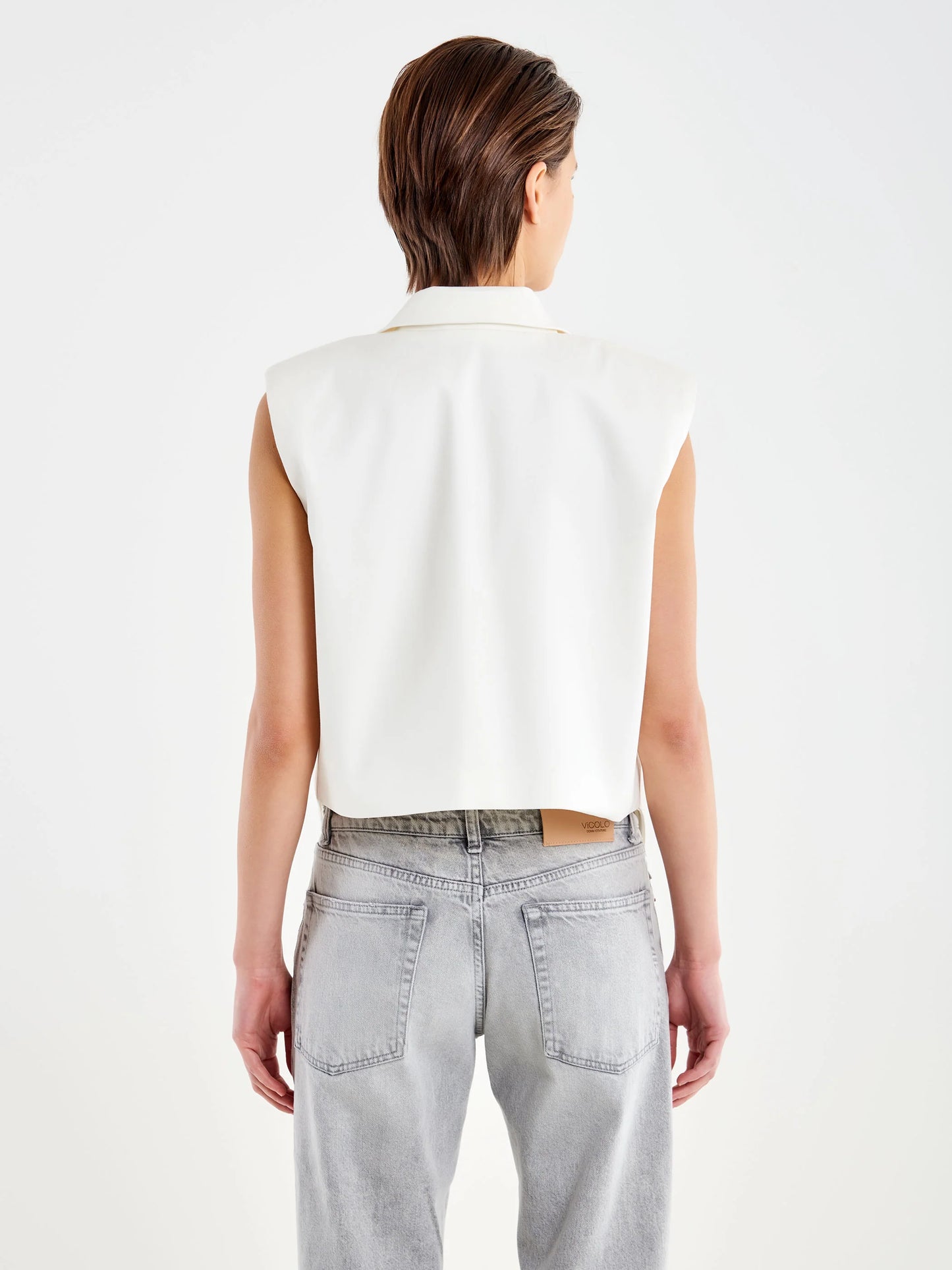 Sleeveless vest with hanging strings Baroc Boutique