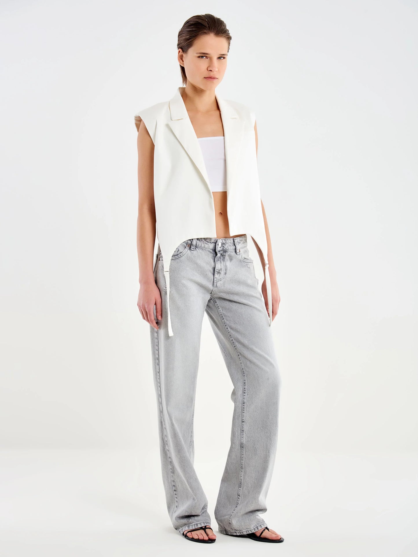 Sleeveless vest with hanging strings Baroc Boutique