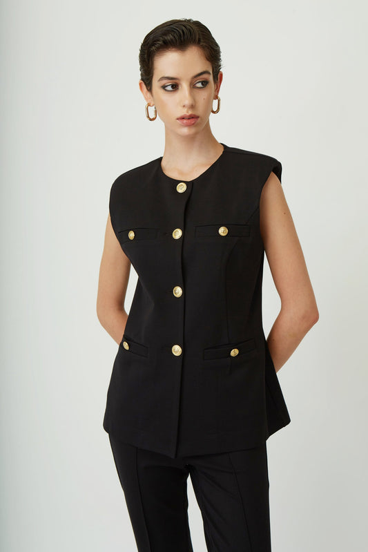 Sleeveless vest with gold buttons